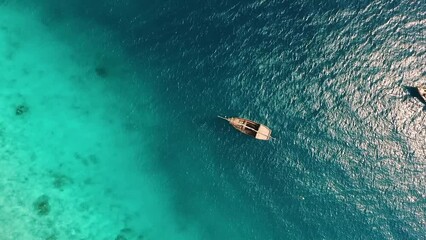 Wall Mural - Amazing View From Drone On A Lonely Boat In Transparent Water Of The Ocean Near The Fisherman'S Village On Zanzibar