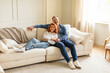 © Home-stock - Happy loving spouses relax on comfortable couch in living room hugging and cuddling together, smiling at camera, free space