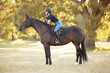 © Terri Cage  - Young equestrian girl woman with horse equine in english tack and riding attire hunter jumper