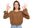 © Krakenimages.com - Young caucasian girl wearing casual clothes relax and smiling with eyes closed doing meditation gesture with fingers. yoga concept.