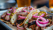 © Laurent - modern texas bbq food truck brisket tacos with pickled onions and jalapeños, served with a side of vibrant flavors and refreshing drinks