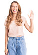 © Krakenimages.com - Young beautiful caucasian woman with blond hair wearing casual clothes showing and pointing up with fingers number five while smiling confident and happy.
