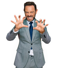 Poster - Middle age man wearing business clothes smiling funny doing claw gesture as cat, aggressive and sexy expression