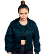© Krakenimages.com - Young hispanic girl wearing sportswear skeptic and nervous, frowning upset because of problem. negative person.