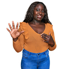 Canvas Print - Young african woman wearing casual clothes disgusted expression, displeased and fearful doing disgust face because aversion reaction. with hands raised