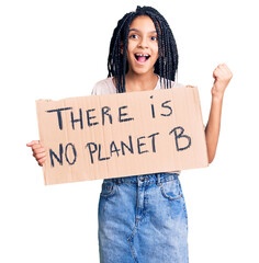 Wall Mural - Cute african american girl holding there is no planet b banner screaming proud, celebrating victory and success very excited with raised arms