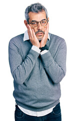 Canvas Print - Middle age hispanic with grey hair wearing glasses tired hands covering face, depression and sadness, upset and irritated for problem