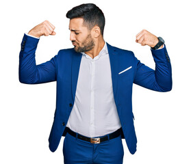 Sticker - Young hispanic man wearing business jacket showing arms muscles smiling proud. fitness concept.