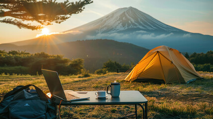 outdoor office or workplace beside camping tent of a farmer at rice field near Fuji mountain, Japan who works as a business freelancer.