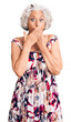 © Krakenimages.com - Senior grey-haired woman wearing casual clothes shocked covering mouth with hands for mistake. secret concept.