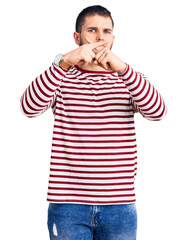 Sticker - Young handsome man wearing striped sweater rejection expression crossing fingers doing negative sign