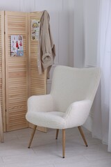 Poster - Folding screen, clothes and armchair in room