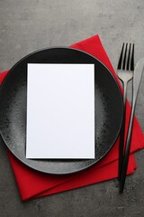 Sticker - Empty menu, plate, cutlery and napkin on grey table, top view. Mockup for design