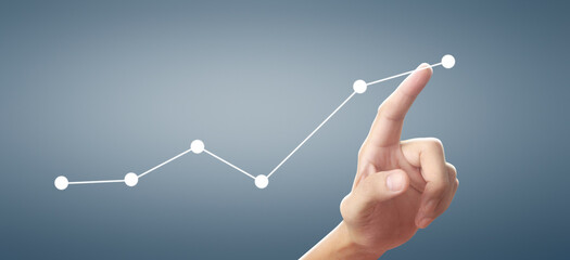 Wall Mural - Hand touching graphs of financial indicator and accounting market economy analysis chart