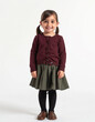 © Nam - a little girl standing in a skirt and sweater