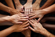 © Sergio - Close-up image captures group of diverse hands, each with unique skin tones, joined together in circle. Hands are stacked on top of one another, symbolizing unity, collaboration, and shared purpose