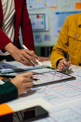 UX developer and ui designer brainstorming about mobile app interface wireframe design with customer breif and color code, User experience concept..