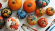 © TheWaterMeloonProjec - Creative pumpkin painting ideas for adults using a pumpkin decorating kit with assorted colored pumpkins paint and brushes