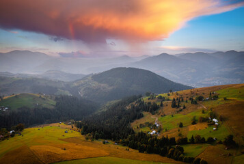 Poster - Fantastic rustic scene with green rolling hills from a bird's eye view. Carpathian mountains, Ukraine.