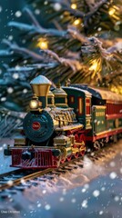 Aufkleber - A vintage, green and gold steam train engine pulls a string of passenger cars through a snowy winter landscape, with the trains headlight glowing brightly as it makes its way under a snow-covered ever