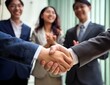 © LL - business people shaking hands