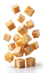 Wall Mural - Falling crouton cubes isolated on white background, clipping path, Selective focus