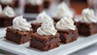 © lucegrafiar - Elegant Chocolate Brownies with Whipped Cream Topping