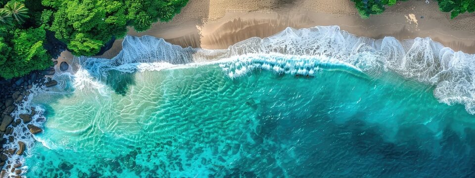 An aerial view of the marine landscape of waves crashing on a beautiful and breathtaking beach 