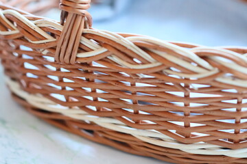 Poster - A close-up of a wicker basket sitting on a table with various items inside
