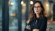 © Photolife   - portrait of a beautiful middle-aged Caucasian business woman wearing glasses in the office looking at the camera, copyspace. business woman portrait