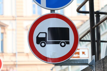 Aufkleber - Red and white sign with warning symbol and blue and white sign with another warning symbol for road users