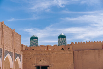 Canvas Print - The building has two domes on top of it. The domes are green and white