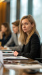 © Graphic Master - Female professional in a corporate boardroom, sitting at the head of a long table