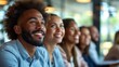 © 路加 石 - Happy multi-ethnic business people sit together in the office, laughing and smiling while listening to a close-up portrait of a lecture or training session