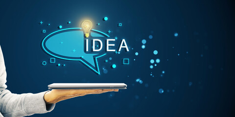 Aufkleber - A hand holding a tablet with a bright lightbulb and IDEA caption in a speech bubble on a blue background, symbolizing inspiration and innovation