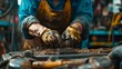 © Barosanu - Image of a mechanic's hands covered in dirt and oil while wearing gloves and working on engine parts, showcasing the gritty and meticulous nature of the job.