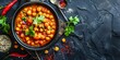 © Anastasiia - Overhead view of Indian chickpea dish with copy space highquality image. Concept Indian Cuisine, Chickpea Dish Photography, Overhead View, Copy Space, High-Quality Image