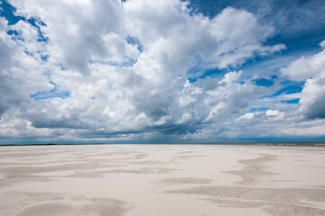 cold sunny weather with storm and heavy clouds on the beach of the island of schiermonnikoog, in jun