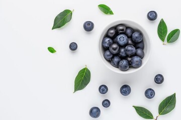 Wall Mural - Fresh blueberries in a bowl with green leaves on white background