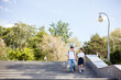 © Natalia - boy and a girl, two teenagers, friends, go to school, go down the stairs, laugh merrily. Back to School. Copy space