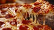 © iVGraphic - Close-up of a cheesy pepperoni pizza slice being pulled away