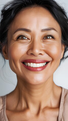 Wall Mural - Closeup Portrait of pretty smiling mature asian woman isolated on white background