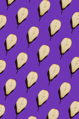 Wall Mural - Creative pattern made of raw sliced pears on bright violet background with shadow. Minimal style. Healthy food ingredient concept. Top view. Flat lay