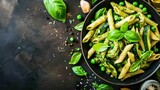 Pesto pasta. Pasta spaghetti with pesto sauce and fresh basil leaves isolated on a background with copy space. . Italian Food Concept with Copy Space.