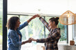 © Wavebreak Media - Dancing together, two women enjoying time at home, smiling and holding hands
