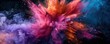 © Dalibor - A dramatic explosion of pink and blue powder on a black background. The details of the powder in motion create a dynamic and visually stunning composition. Free copy space for banner.