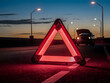 © Leonardo - Emergencia en la ruta con triángulo reflectivo color rojo
