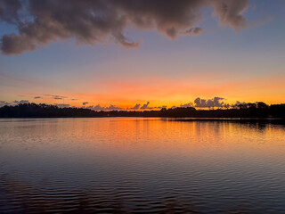 Sunrise over still water. 