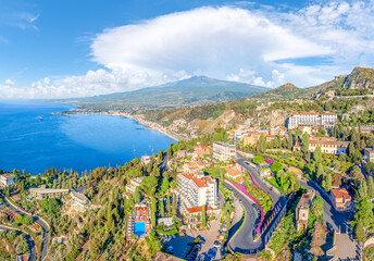 Wall Mural - Landscape with Etna volcano and Taormina town aerial panoramic view, Sicily, Italy