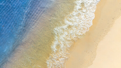  Top view nature of the beach and sea Summer with sunshine sandy beaches, clear blue waters sparkling against the blue sky. on an island with good ecology and environment Background for summer vacation